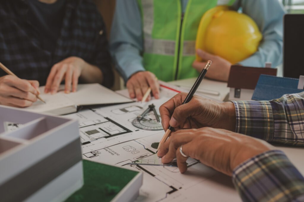 Business a meeting of architects who work hard together to create outstanding work. engineers and contractors collaborate to solve problems that arise in design and construction.