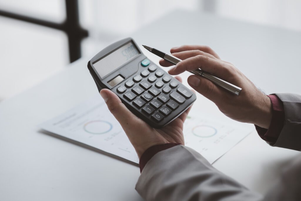 Business a financier is reviewing company financial documents, monthly fi